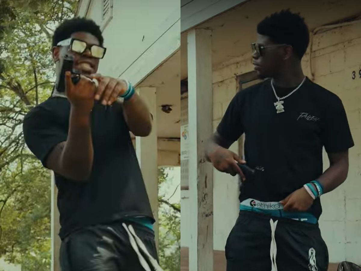 Georgia Rapper Terrell Monquez Searcy with a gun in his music video, Traffic. (Image via YouTube/@quez2rr)
